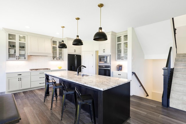 4737 130th Ln NE, Blaine, MN 55449 - kitchen with stainless steel appliances, a sink, dark wood finished floors, decorative backsplash, and recessed lighting