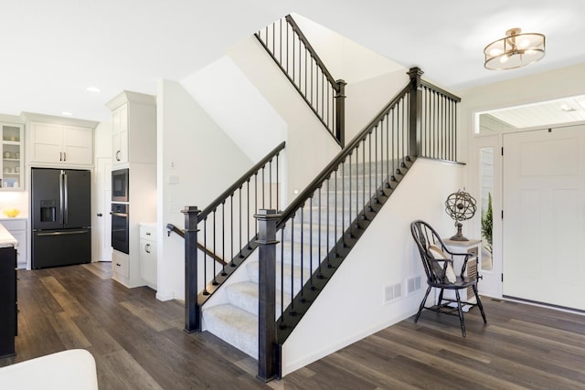 4737 130th Ln NE, Blaine, MN 55449 - staircase featuring wood finished floors, recessed lighting, a chandelier, and baseboards