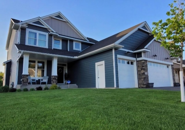 4737 130th Ln NE, Blaine, MN 55449 - craftsman-style home with a porch, board and batten siding, an attached garage, and a front lawn