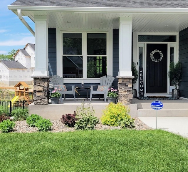 4737 130th Ln NE, Blaine, MN 55449 - property entrance featuring covered porch and roof with shingles