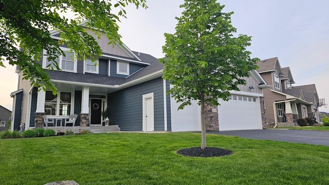 4737 130th Ln NE, Blaine, MN 55449 - craftsman house with board and batten siding, a garage, covered porch, and asphalt driveway