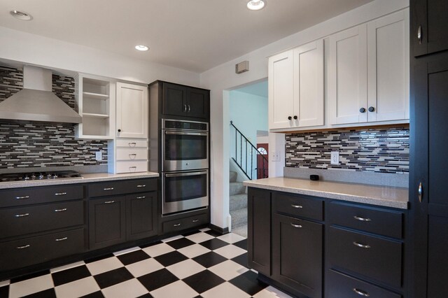 7740 Arlington Ave N, Brooklyn Park, MN 55443 - kitchen with light floors, double oven, wall chimney range hood, gas cooktop, and white cabinets