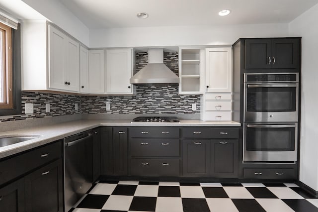 7740 Arlington Ave N, Brooklyn Park, MN 55443 - kitchen with wall chimney exhaust hood, stainless steel appliances, light floors, and white cabinetry