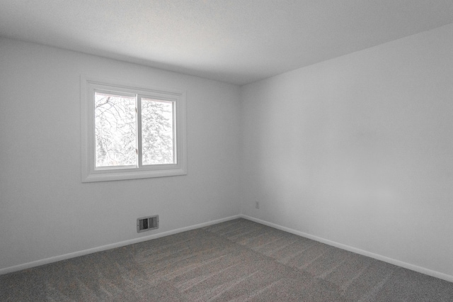 7740 Arlington Ave N, Brooklyn Park, MN 55443 - carpeted spare room with baseboards and visible vents