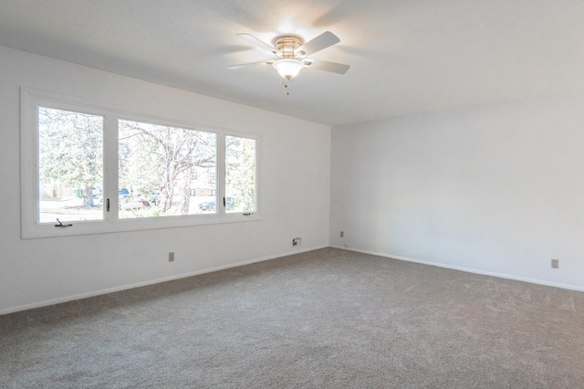 7740 Arlington Ave N, Brooklyn Park, MN 55443 - unfurnished room featuring baseboards, carpet floors, and ceiling fan