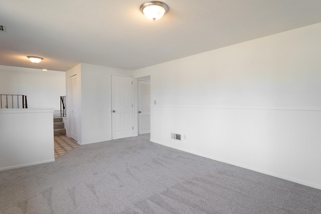 7740 Arlington Ave N, Brooklyn Park, MN 55443 - spare room with carpet, visible vents, and baseboards
