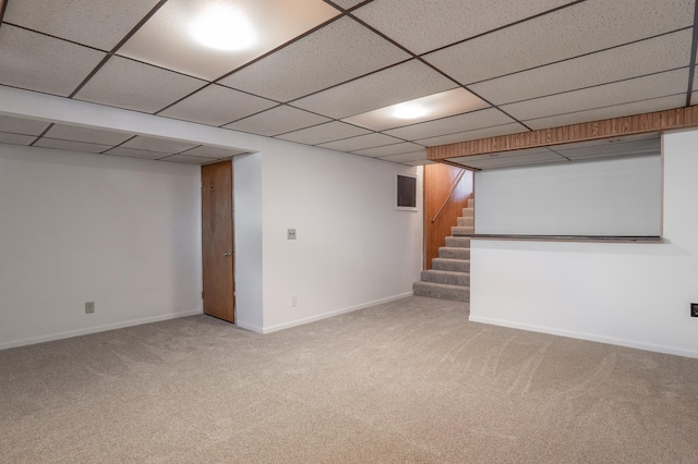 7740 Arlington Ave N, Brooklyn Park, MN 55443 - finished below grade area featuring baseboards, a paneled ceiling, carpet flooring, and stairway