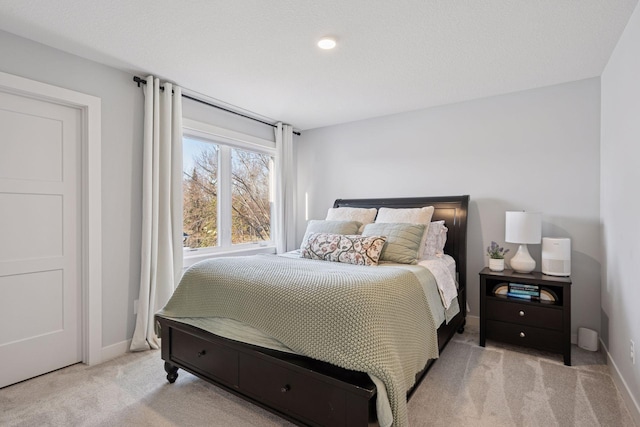 bedroom with carpet flooring and baseboards