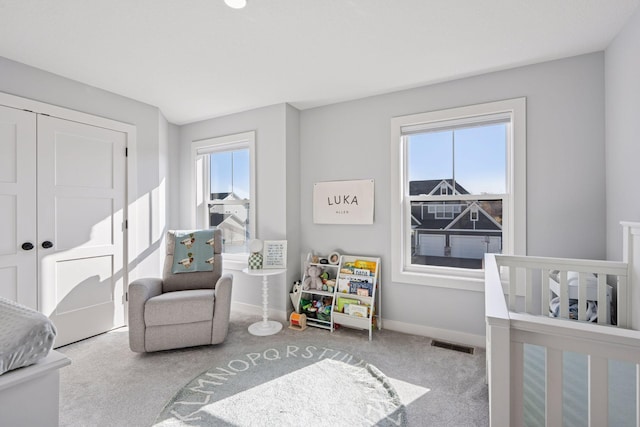 bedroom featuring baseboards, visible vents, and carpet floors