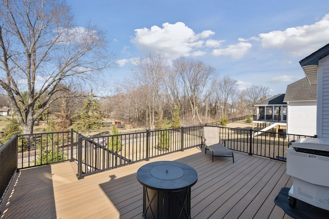 wooden terrace with area for grilling