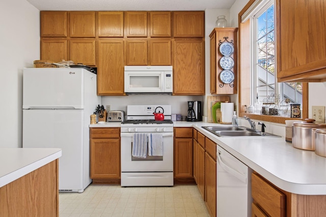 907 Fairfield Way, Minnetonka, MN 55305 - kitchen featuring white appliances, light countertops, and brown cabinets
