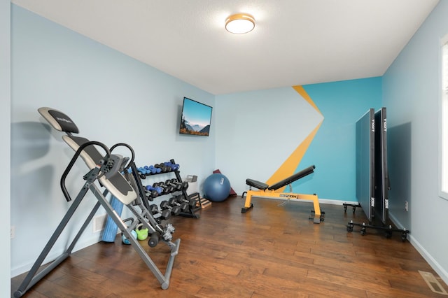 1602 River St, Monticello, MN 55362 - workout area featuring hardwood / wood-style flooring and baseboards