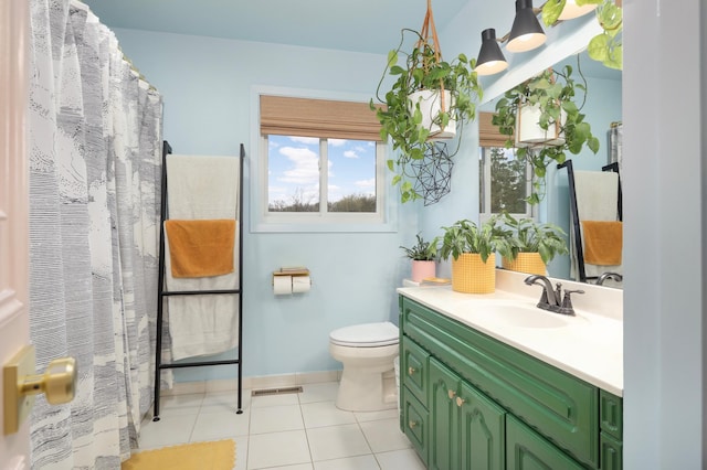 1602 River St, Monticello, MN 55362 - bathroom with toilet, vanity, tile patterned flooring, and baseboards