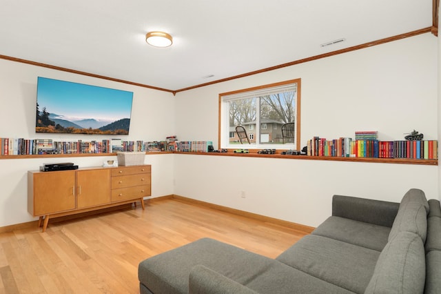 1602 River St, Monticello, MN 55362 - living room featuring light wood-style flooring, crown molding, and baseboards
