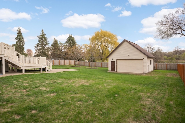1602 River St, Monticello, MN 55362 - view of yard with stairway, a detached garage, a deck, and an outbuilding