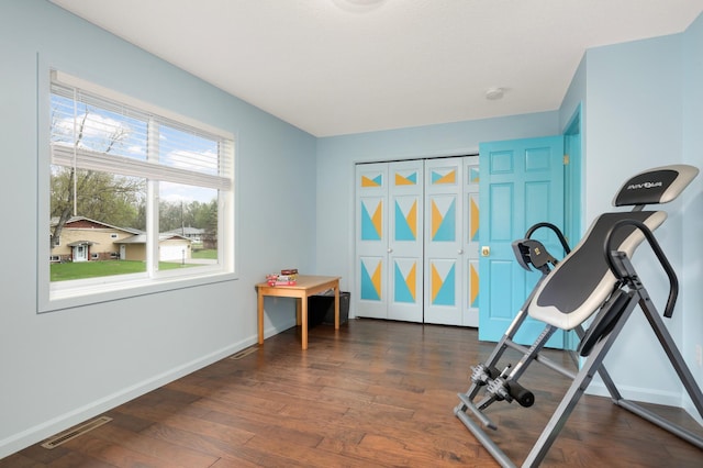 1602 River St, Monticello, MN 55362 - exercise room with dark wood-style floors and baseboards
