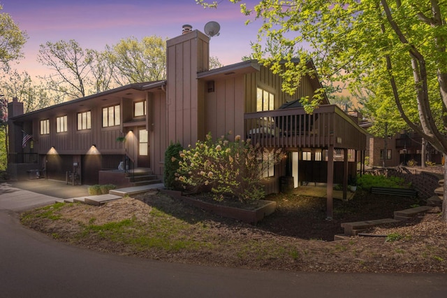 2628 Sumac Ct, White Bear Lake, MN 55110 - view of front of property with a chimney, board and batten siding, and a wooden deck