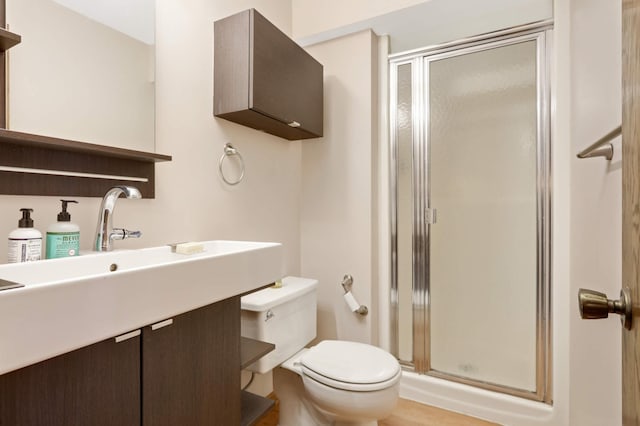 2628 Sumac Ct, White Bear Lake, MN 55110 - bathroom featuring a stall shower, toilet, and vanity