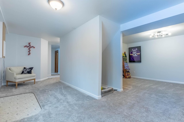 unfurnished room featuring carpet flooring and baseboards