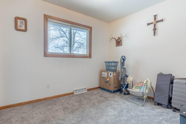miscellaneous room featuring carpet flooring and baseboards