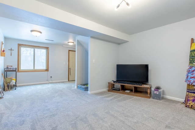 living room with carpet floors and baseboards