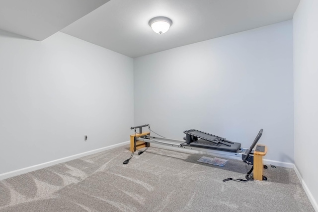 workout area with carpet and baseboards