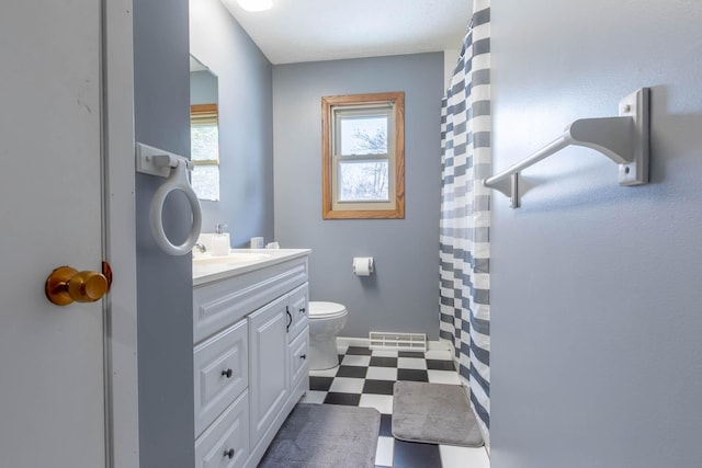 full bathroom with tile patterned floors, toilet, and vanity