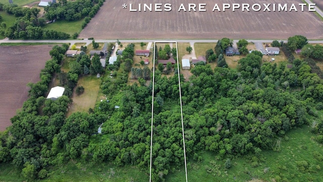 aerial view of property and surrounding area with property parcel outlined