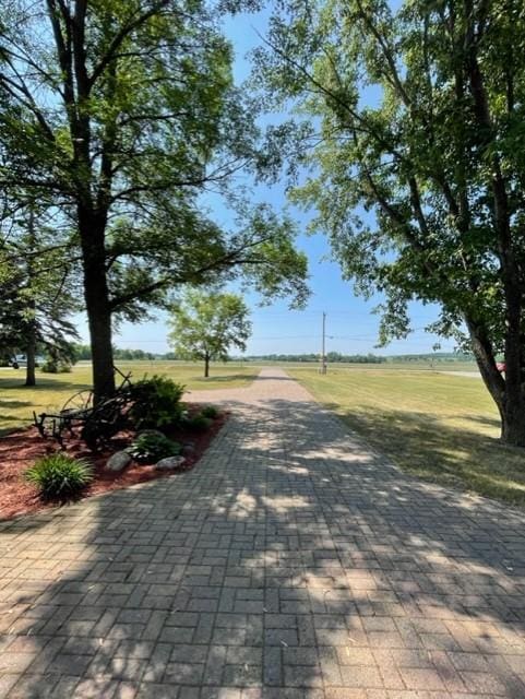 surrounding community featuring a yard