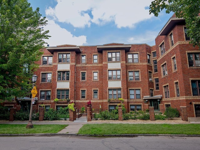 view of property featuring a fenced front yard