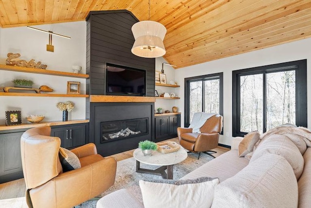 living room with wood ceiling, a fireplace, lofted ceiling, and light wood-style flooring