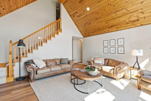 living room with wooden ceiling, stairs, high vaulted ceiling, and wood finished floors