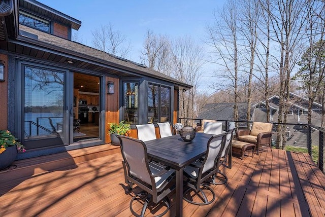 wooden deck with outdoor dining area