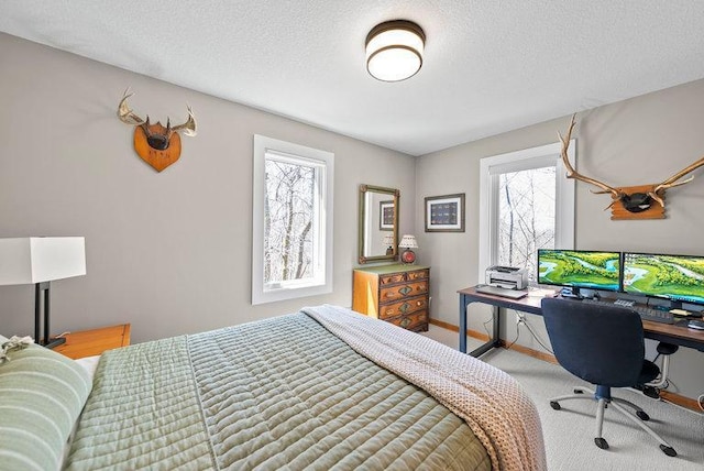 bedroom with carpet flooring and a textured ceiling