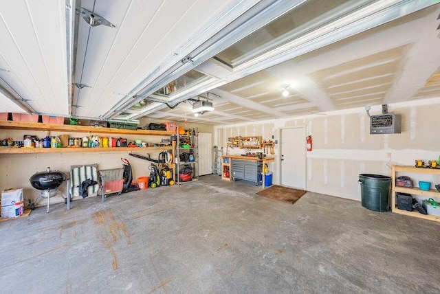 garage featuring a workshop area and a garage door opener