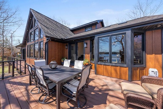 wooden terrace with outdoor dining space