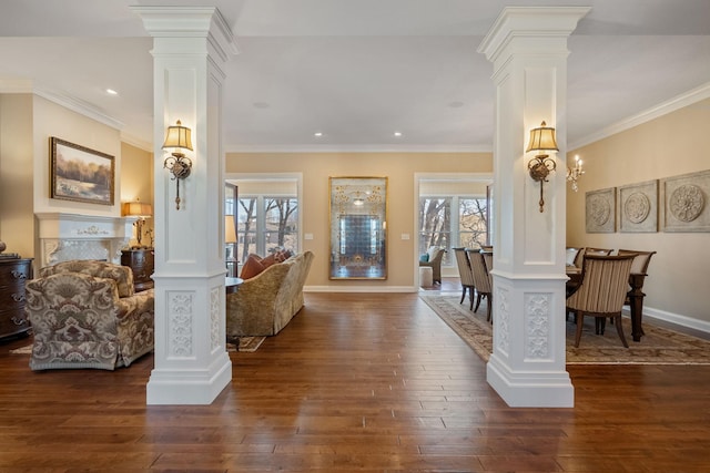 2834 12th Ave NW, Austin, MN 55912 - living room with decorative columns, dark wood-style floors, baseboards, recessed lighting, and crown molding