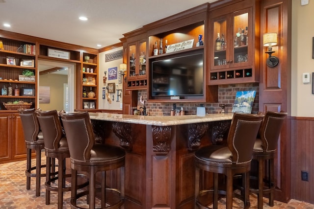2834 12th Ave NW, Austin, MN 55912 - indoor wet bar featuring tasteful backsplash, built in features, recessed lighting, and a wainscoted wall