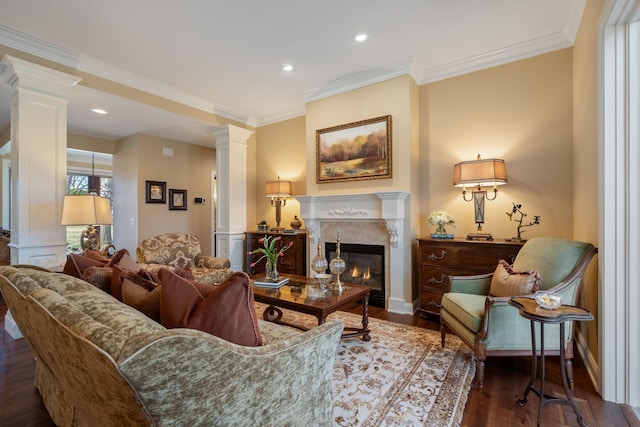 2834 12th Ave NW, Austin, MN 55912 - living area with ornate columns, wood finished floors, a premium fireplace, ornamental molding, and recessed lighting