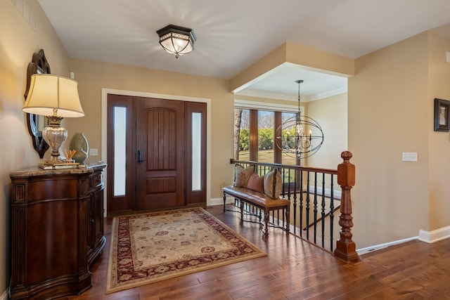 2834 12th Ave NW, Austin, MN 55912 - foyer entrance featuring a chandelier, baseboards, and wood-type flooring