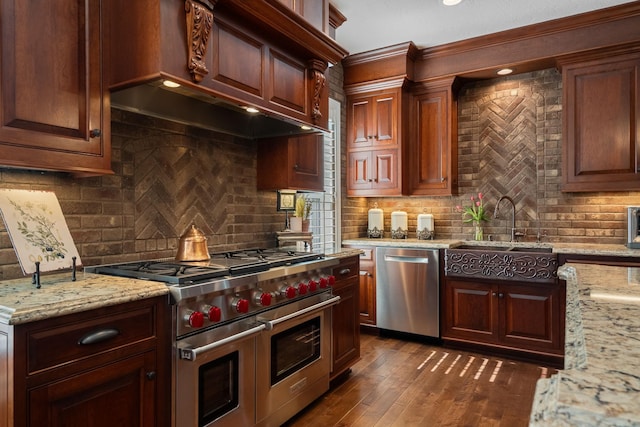 2834 12th Ave NW, Austin, MN 55912 - kitchen featuring stainless steel appliances, a sink, tasteful backsplash, light stone counters, and ornamental molding