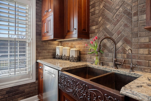 2834 12th Ave NW, Austin, MN 55912 - kitchen featuring a sink, decorative backsplash, light stone counters, and dishwasher