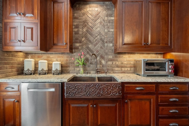 2834 12th Ave NW, Austin, MN 55912 - kitchen with stainless steel dishwasher, tasteful backsplash, a sink, and light stone counters