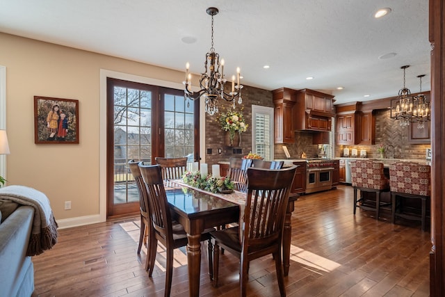 2834 12th Ave NW, Austin, MN 55912 - dining area featuring a chandelier, dark wood-style flooring, baseboards, and recessed lighting