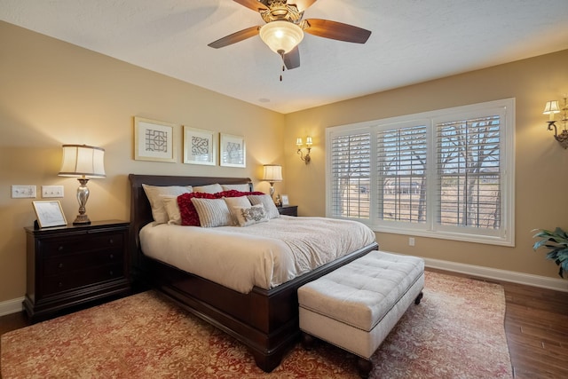 2834 12th Ave NW, Austin, MN 55912 - bedroom with baseboards, wood finished floors, and a ceiling fan