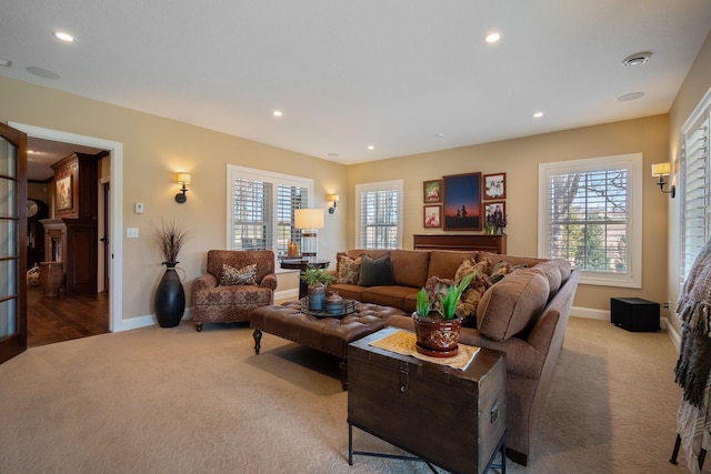 2834 12th Ave NW, Austin, MN 55912 - living room featuring light colored carpet, baseboards, plenty of natural light, and recessed lighting