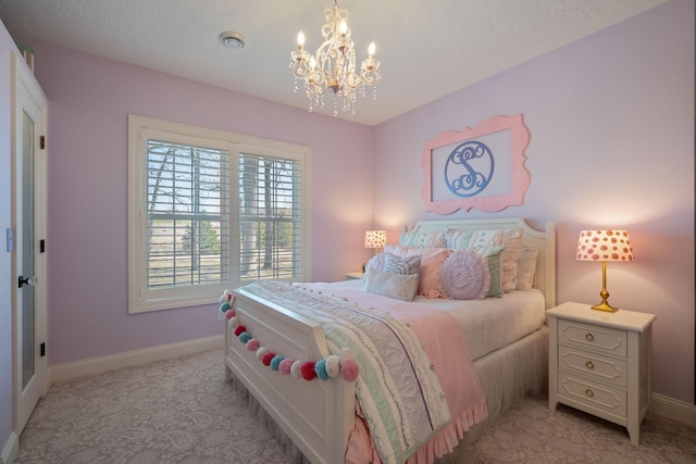 2834 12th Ave NW, Austin, MN 55912 - bedroom with light carpet, baseboards, a chandelier, and a textured ceiling