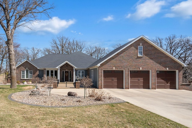 2834 12th Ave NW, Austin, MN 55912 - view of front of home with brick siding, driveway, and a front yard