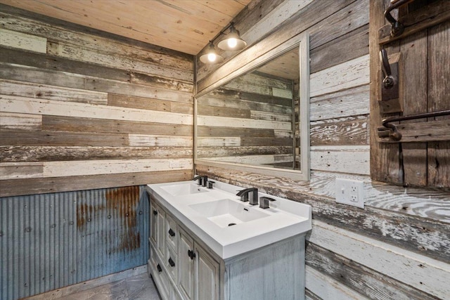 16688 248th St, Long Prairie, MN 56347 - bathroom featuring double vanity, wooden walls, wood ceiling, and a sink