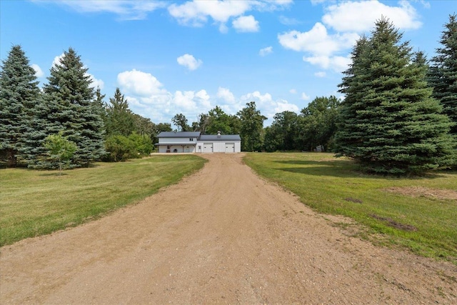 16688 248th St, Long Prairie, MN 56347 - view of front of property featuring a garage, a front lawn, and dirt driveway